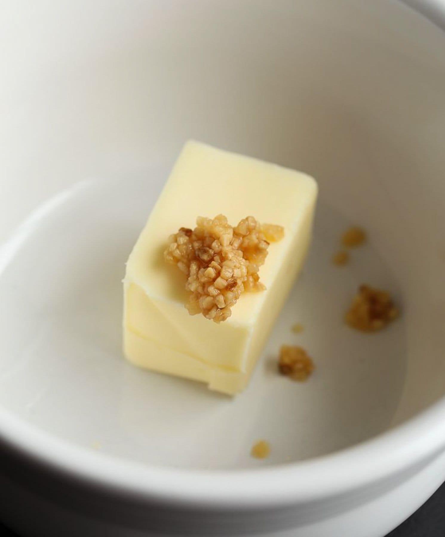 Butter and garlic being mixed together