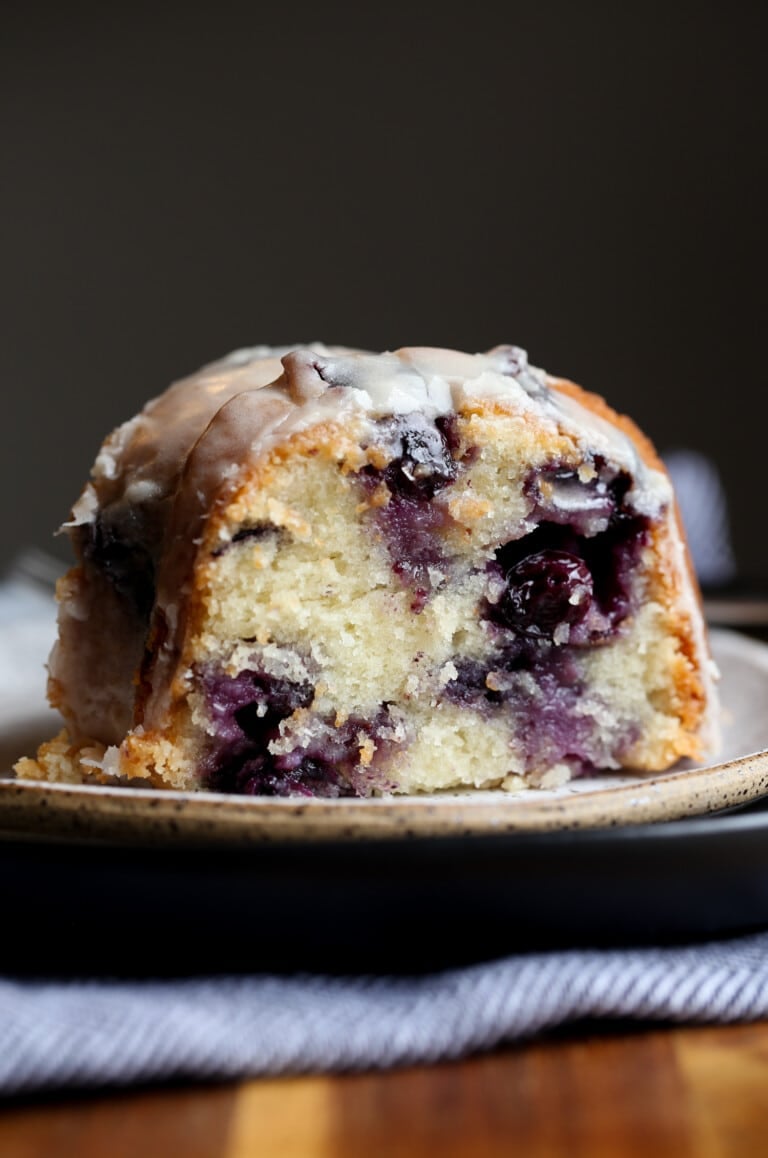 Sour Cream Blueberry Bundt Cake sliced on a plate