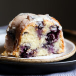 A slice of blueberry bundt cake on a plate.