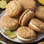 Overhead view of key lime sandwich cookies piled on a plate.