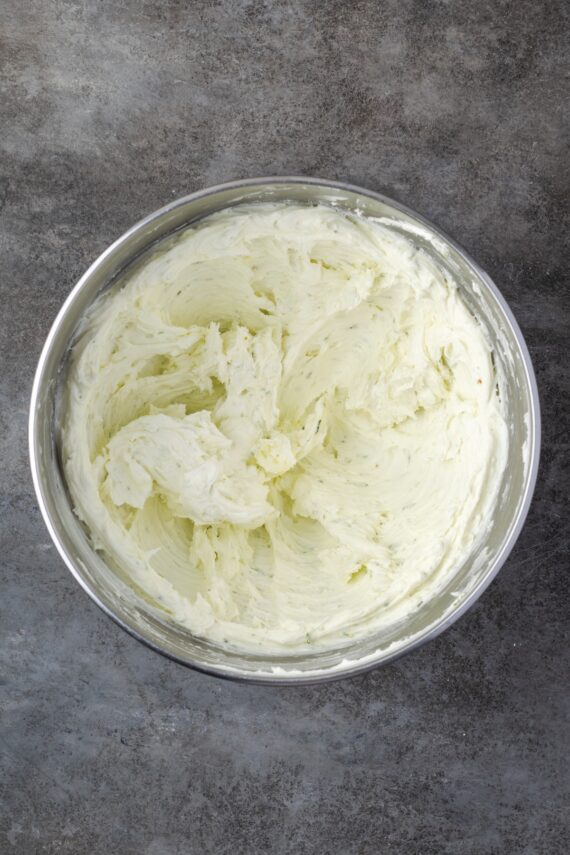 Key lime buttercream frosting in a mixing bowl.