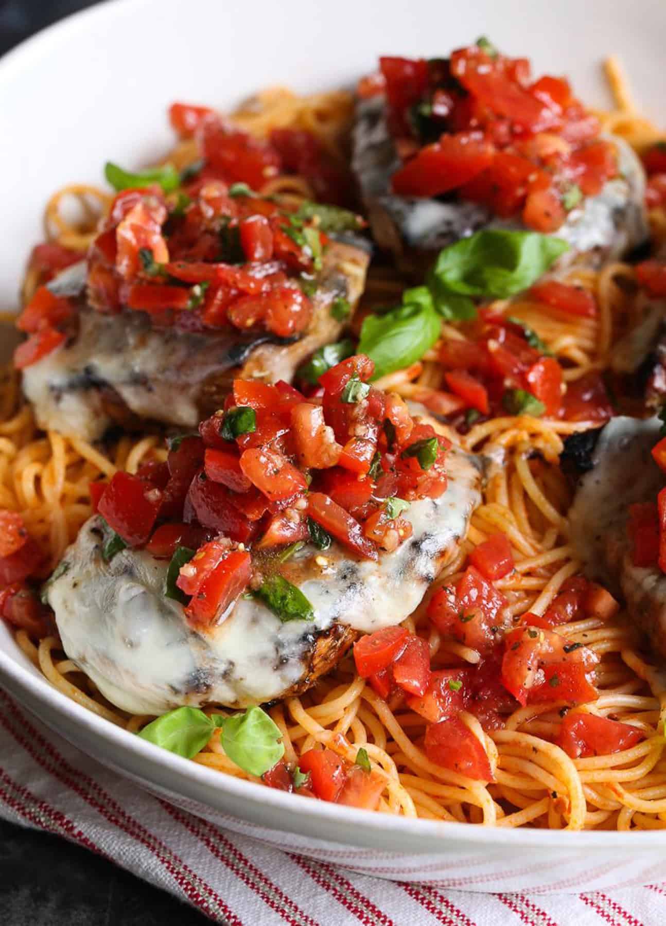 Grilled bruschetta chicken topped with tomatoes