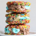 Three Fruity Pebble Ice Cream Sandwiches stacked on top of each other
