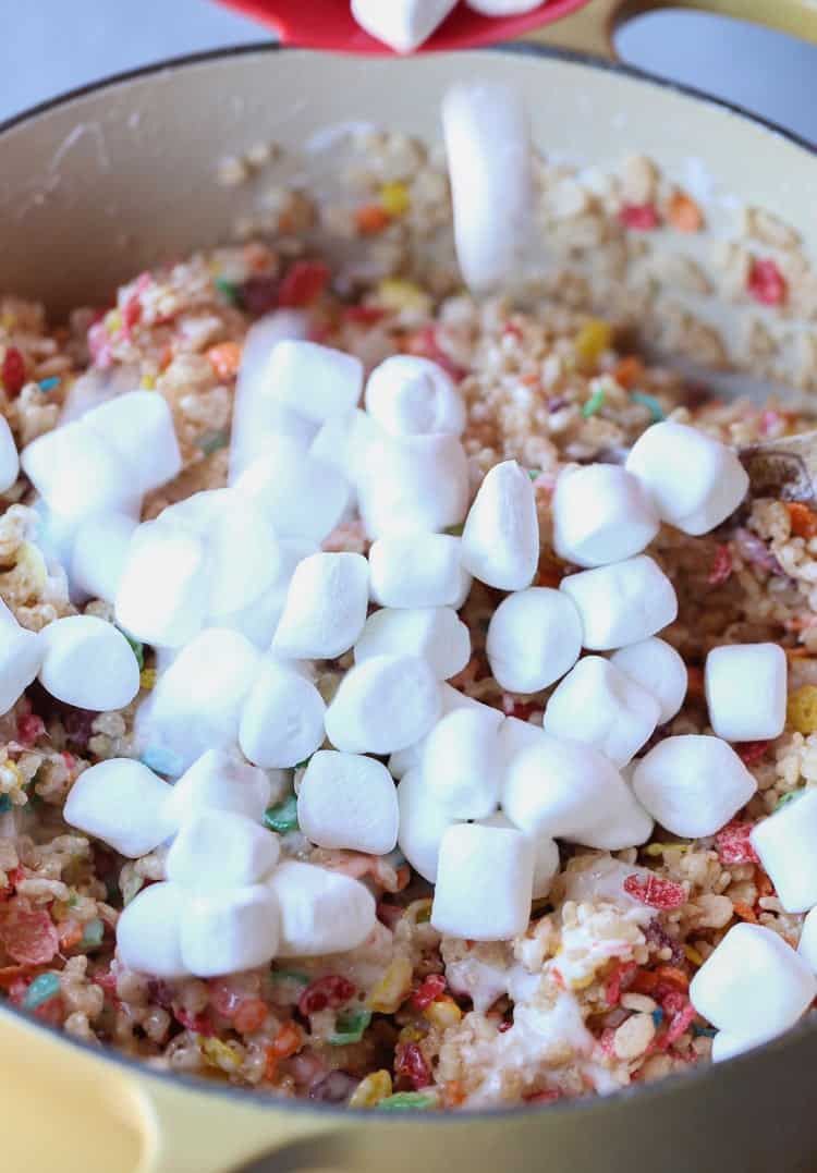 My most favorite krispie treat recipe includes the perfect amount of marshmallow and fruity pebbles! This are my most requested sweet treat at parties!
