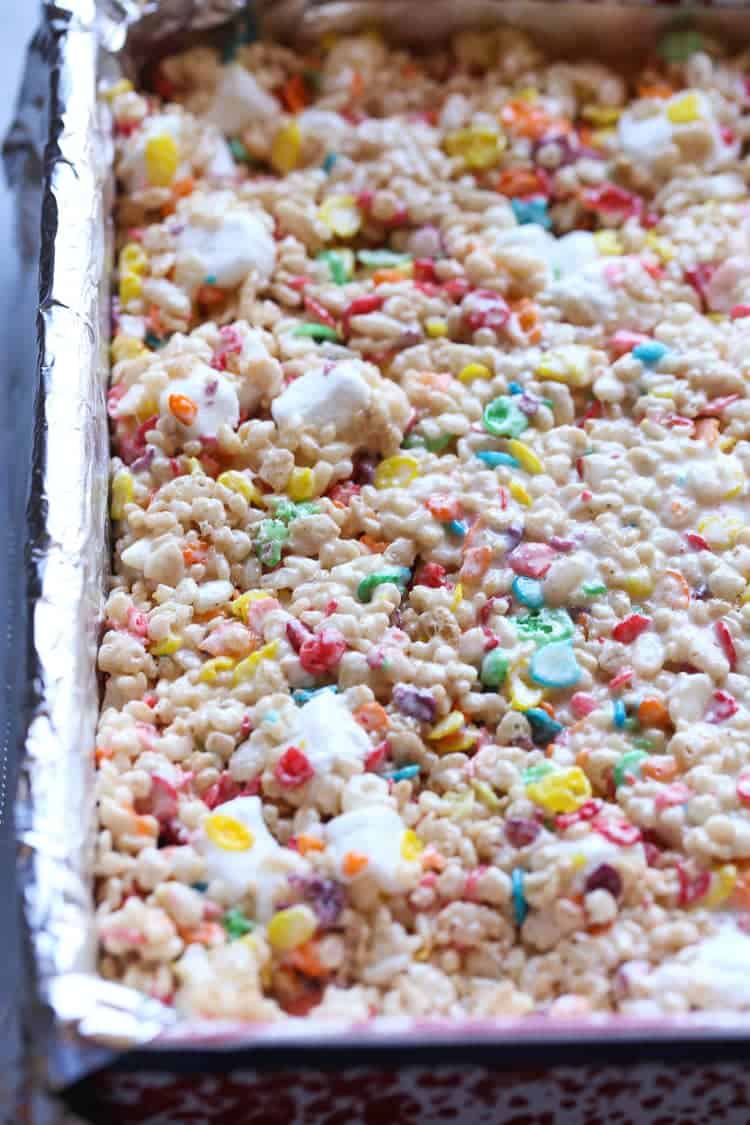 My most favorite krispie treat recipe includes the perfect amount of marshmallow and fruity pebbles! This are my most requested sweet treat at parties!