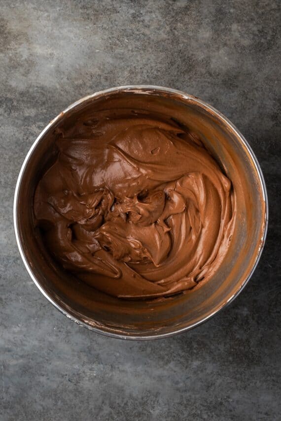 Chocolate frosting in a mixing bowl.