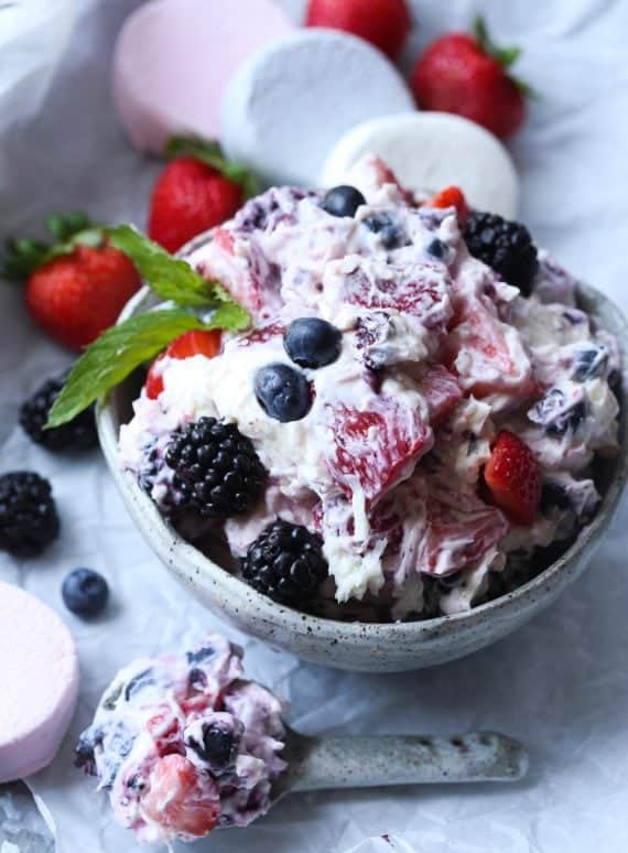 Berry Ambrosia Salad is creamy and perfect for a summer cookout!