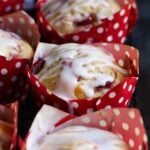 Strawberry Buttermilk Muffins wrapped in red and white polka dot muffin wrappers.