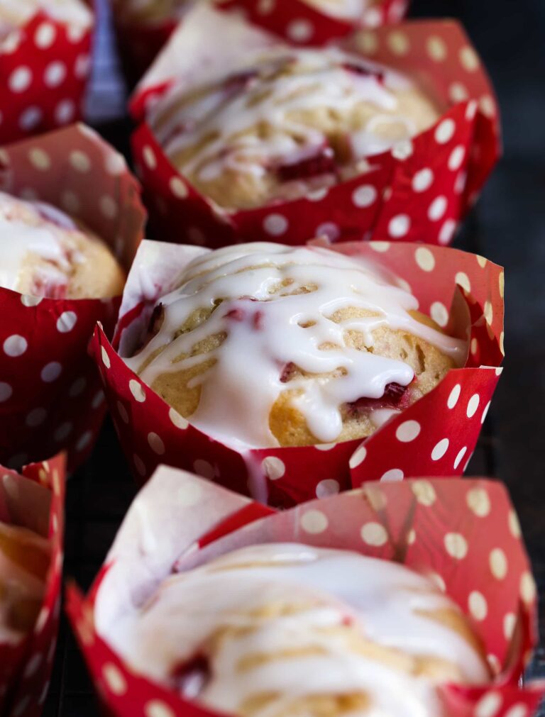 Strawberry Buttermilk Muffins wrapped in red and white polka dot muffin wrappers.