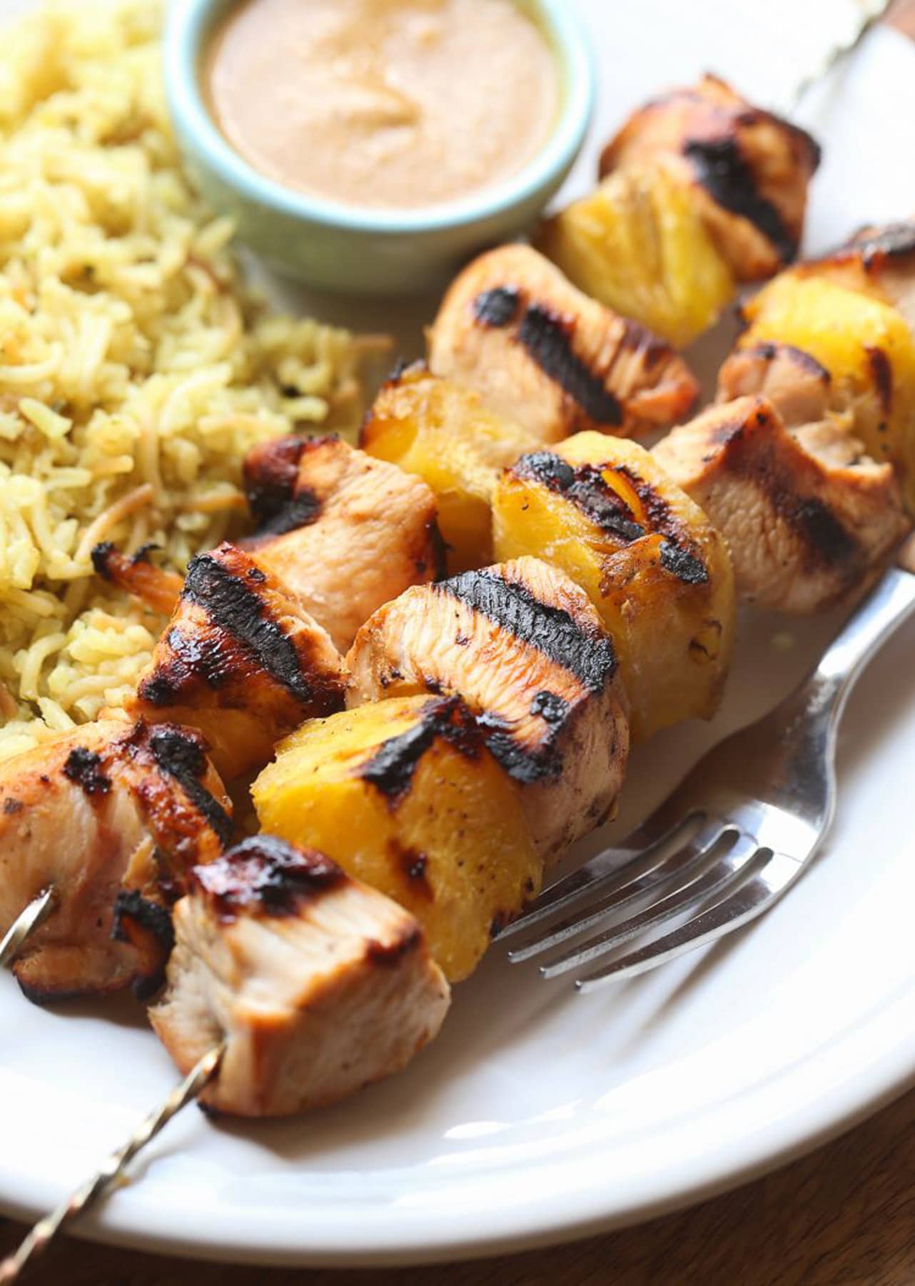 Chicken skewers served with rice