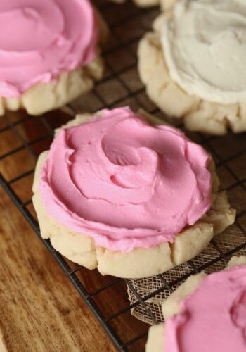 Easy Pressed Sugar Cookies recipe with pink buttercream!