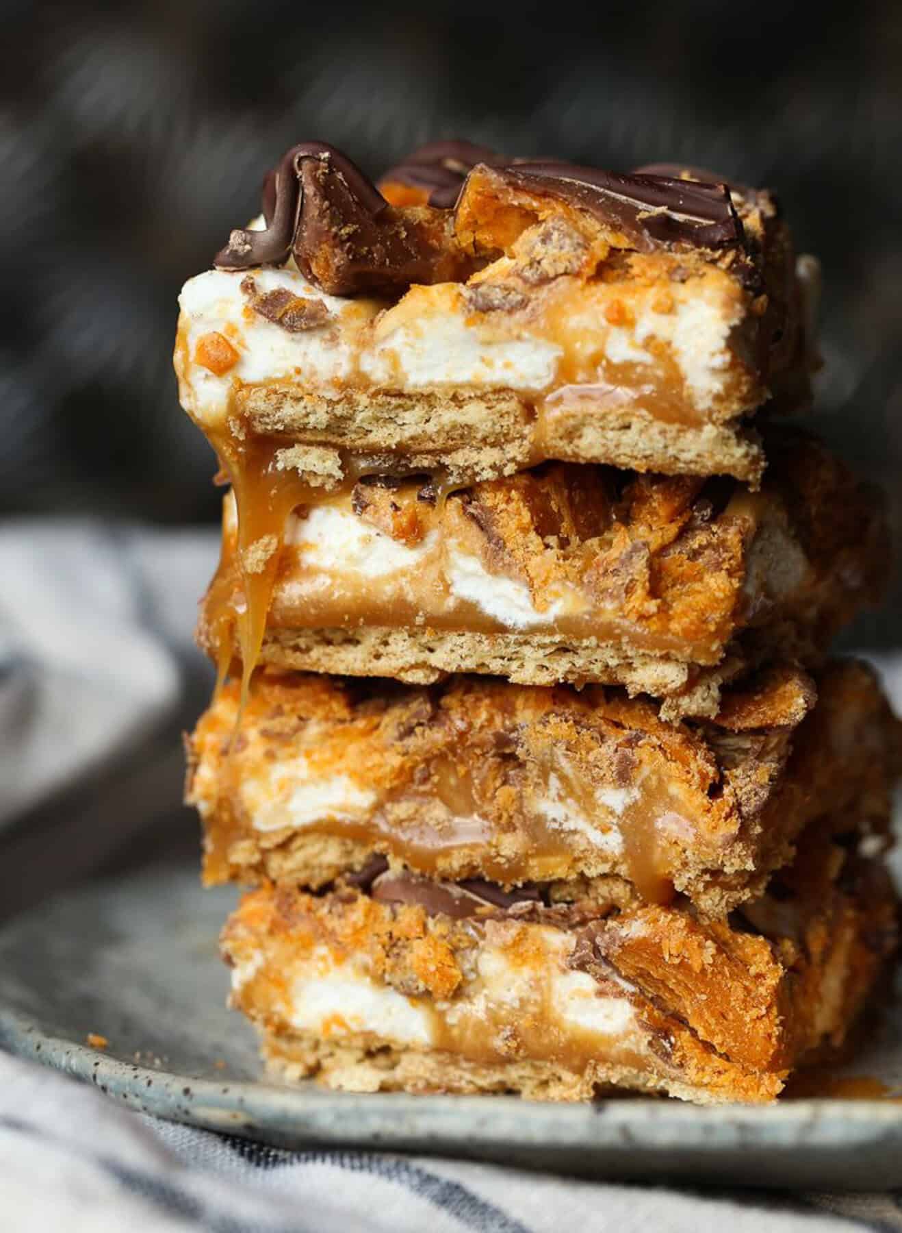 Butterfinger Caramel Bars stacked on top of each other