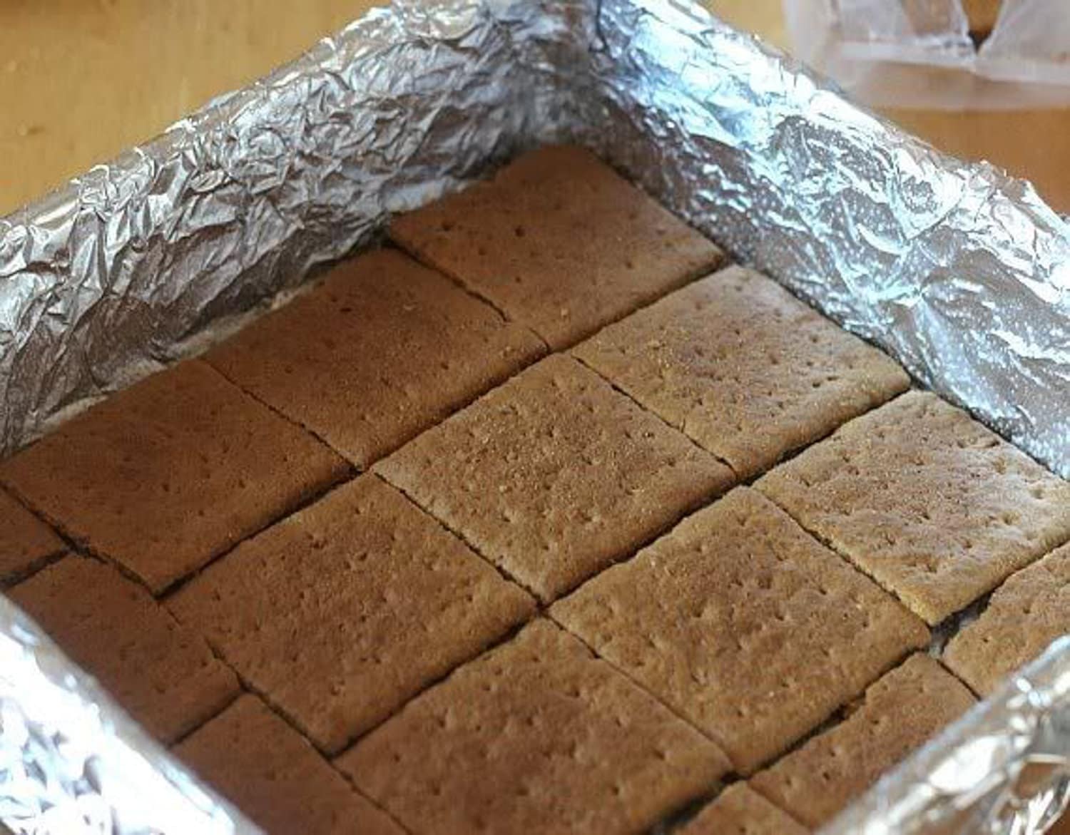 Graham crackers placed in a 9x9 pan
