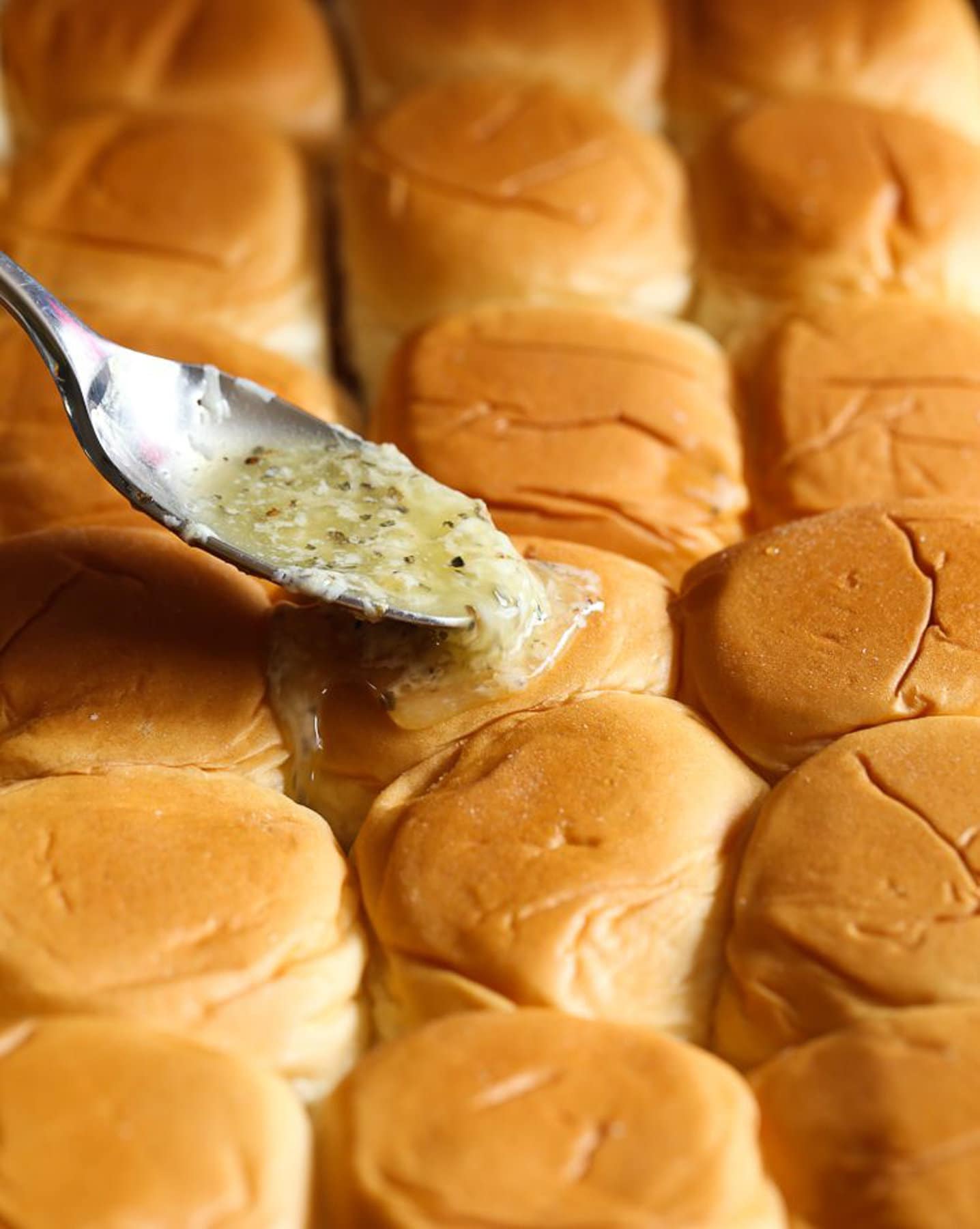 Garlic Butter spread on top of sliders