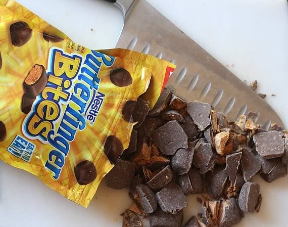 A bag of Butterfinger Bites candy poured out on a cutting board