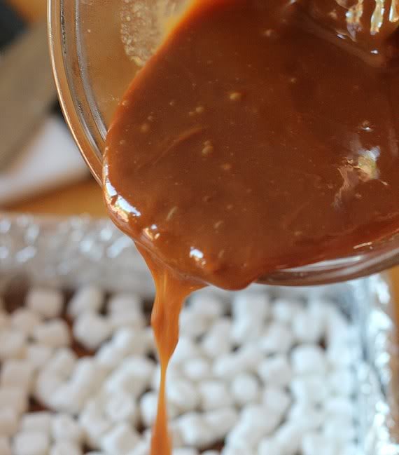 Melted caramel being poured over marshmallows