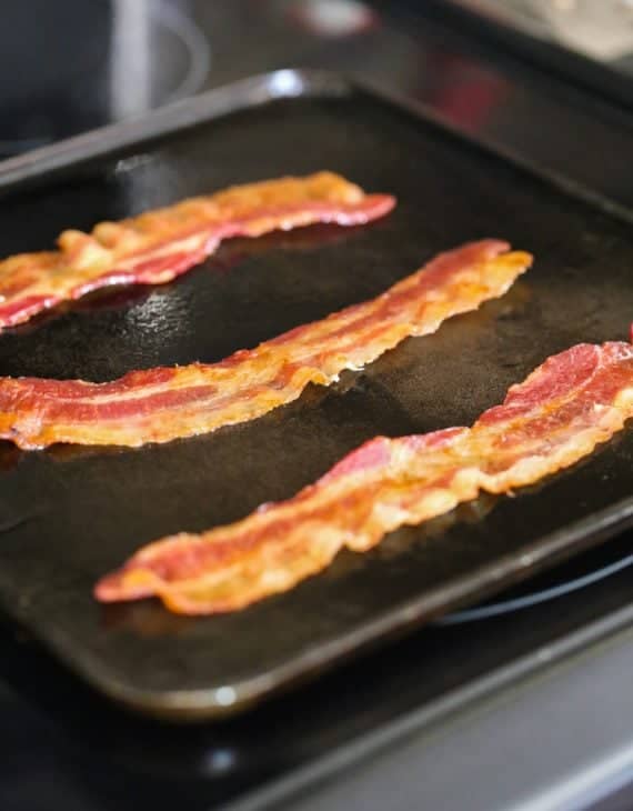 Pancake Bacon Dippers! A soft pancake surrounds a crispy piece of bacon that you can dip right in maple syrup!