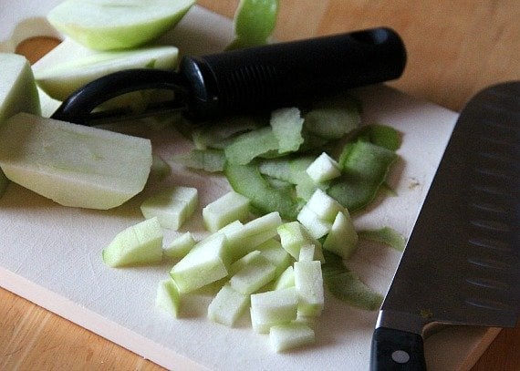 Diced peeled apples on a cutting board