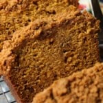 Close up of slices of pumpkin banana bread with a crumb topping.
