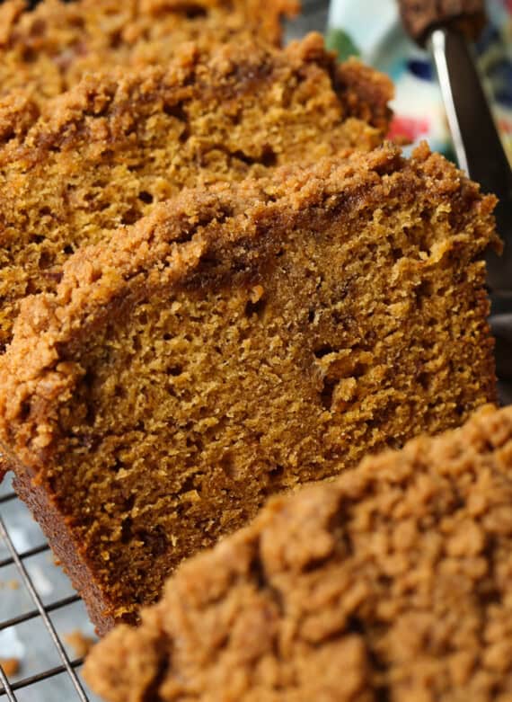 Close up of slices of pumpkin banana bread with a crumb topping.