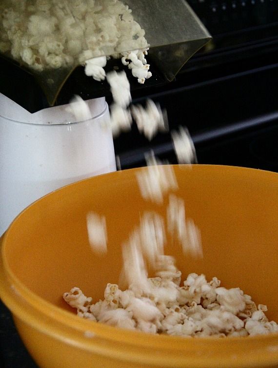 Image of Popped Popcorn Being Added to Bowl