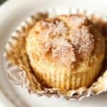 Photo of a snickerdoodle muffin in a muffin wrapper