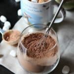 Homemade Hot Chocolate Mix in a glass jar with a whisk