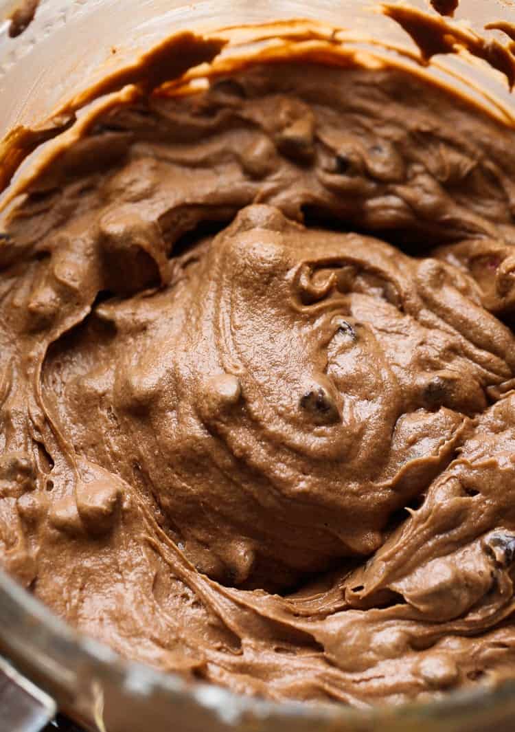 A bowl filled the cake batter for chocolate cake