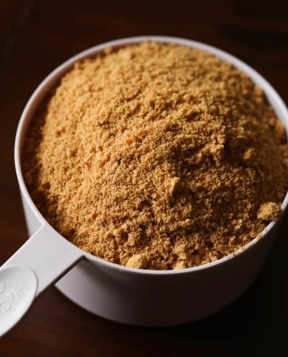 Graham cracker crumbs in a measuring dish