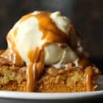 Pumpkin Dump Cake with a scoop of ice cream and caramel sauce!