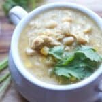 A mug full of creamy Salsa Verde White Chicken Chili.