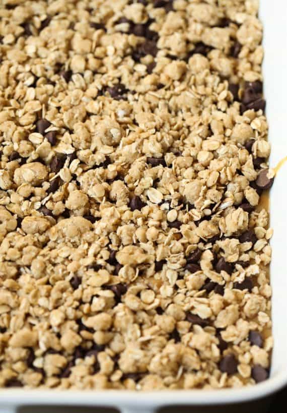 Peanut Butter Passion Bars... a buttery oat bar with a sweet peanut butter caramel filling topped with chocolate chips and more crumble!