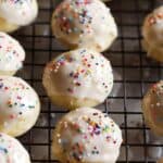 Glazed Italian Ricotta Cookies lined up on a wire rack.