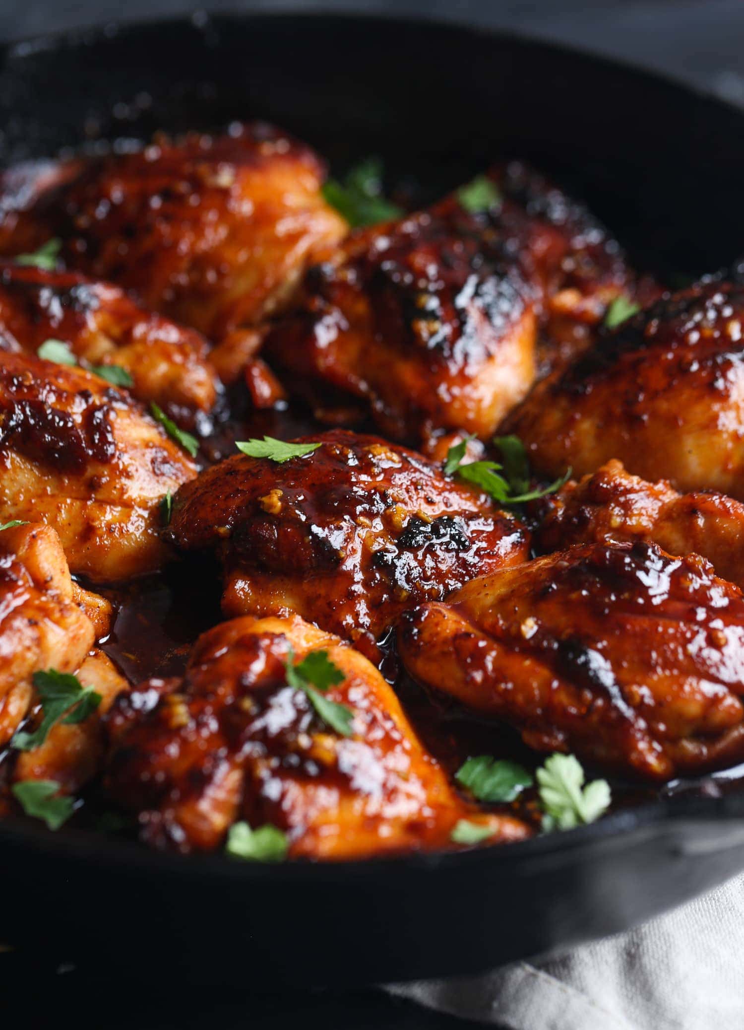 Seared honey chipotle chicken in a skillet.