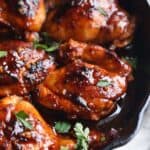 Seared honey chipotle chicken in a skillet.