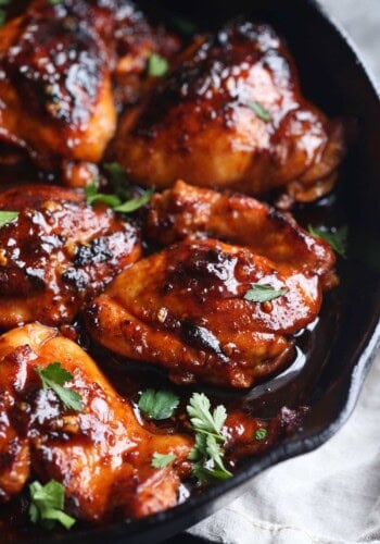 Seared honey chipotle chicken in a skillet.