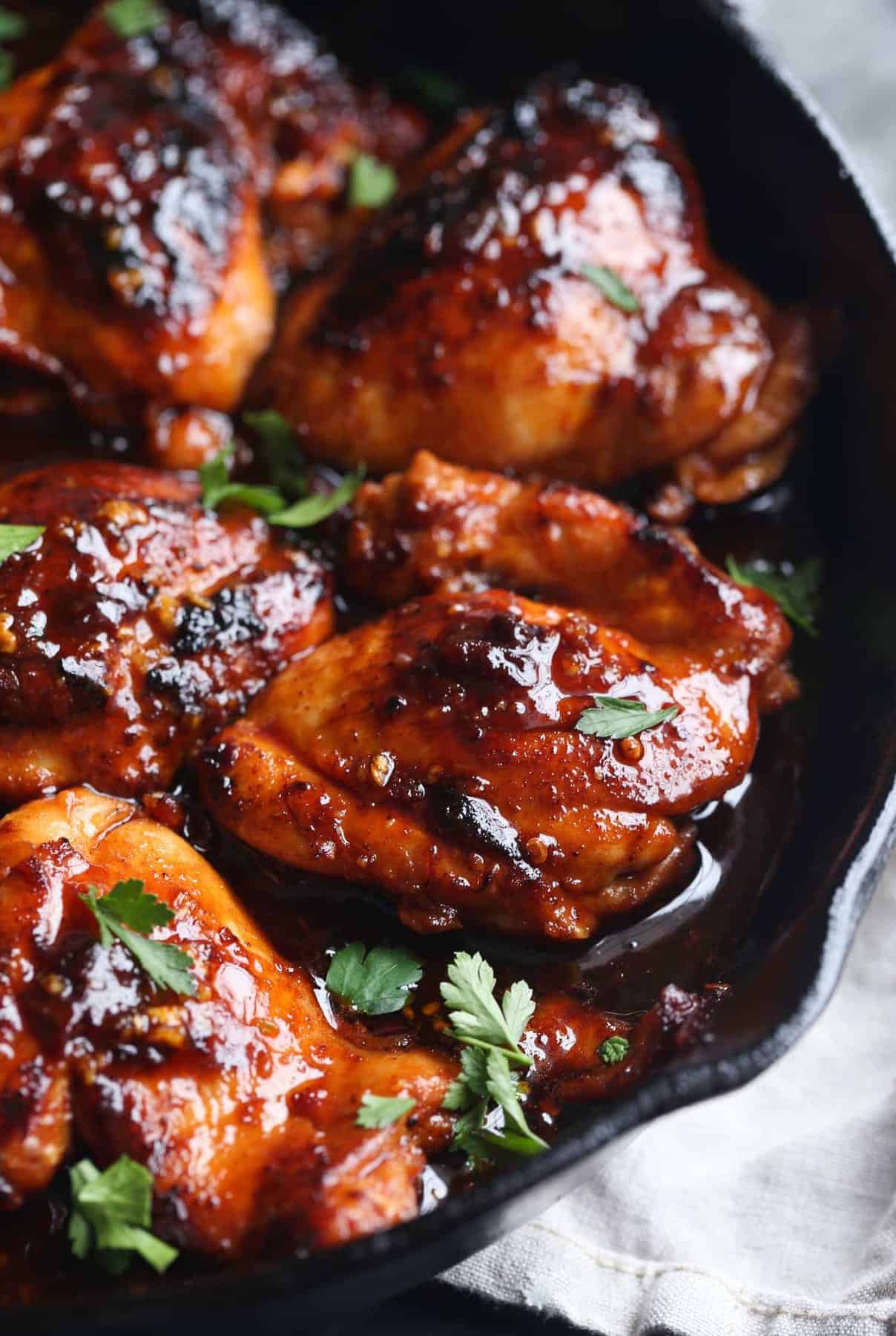 Seared honey chipotle chicken in a skillet.