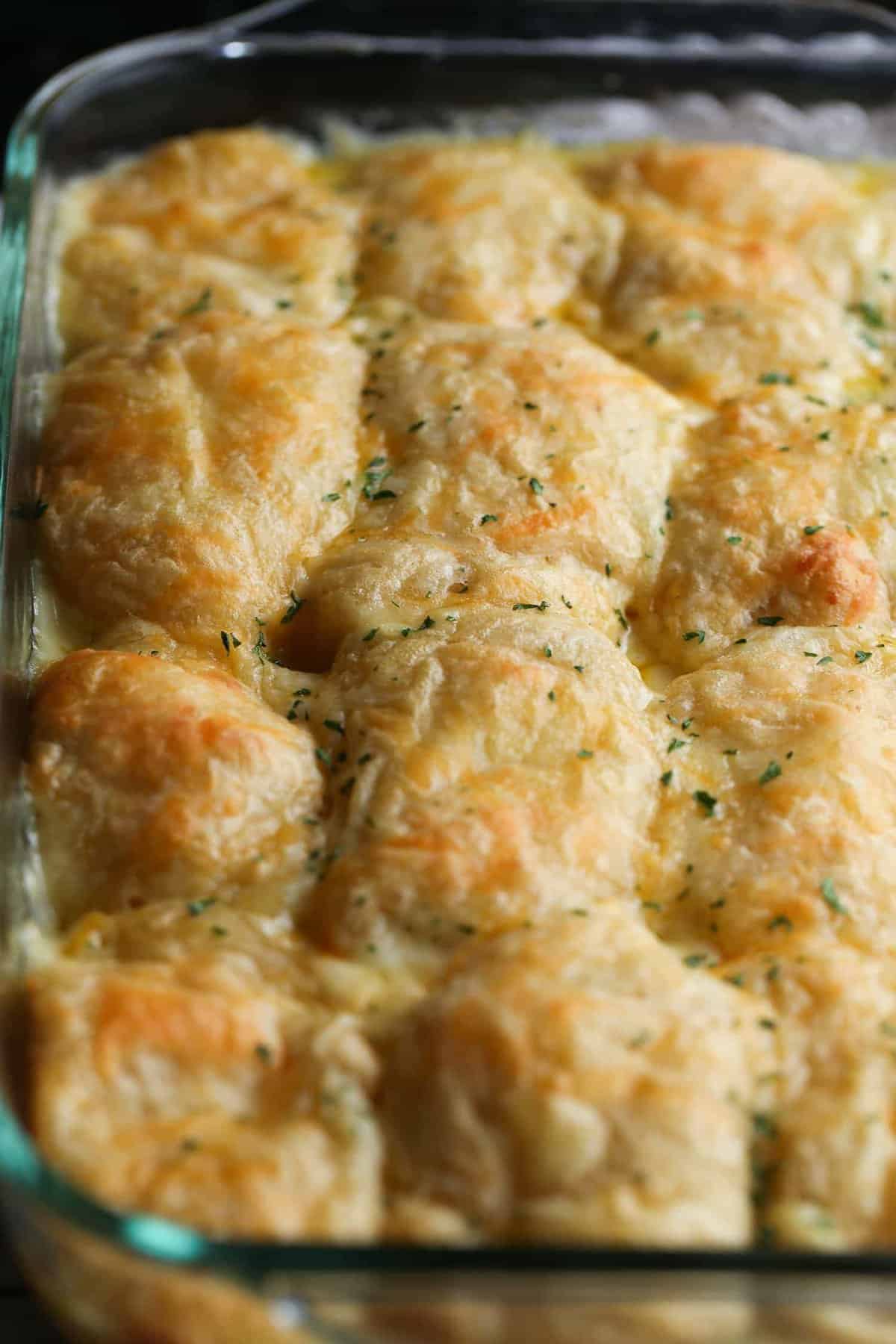 Crescent rolls stuffed with cheese and chicken baked in a 9x13 pan