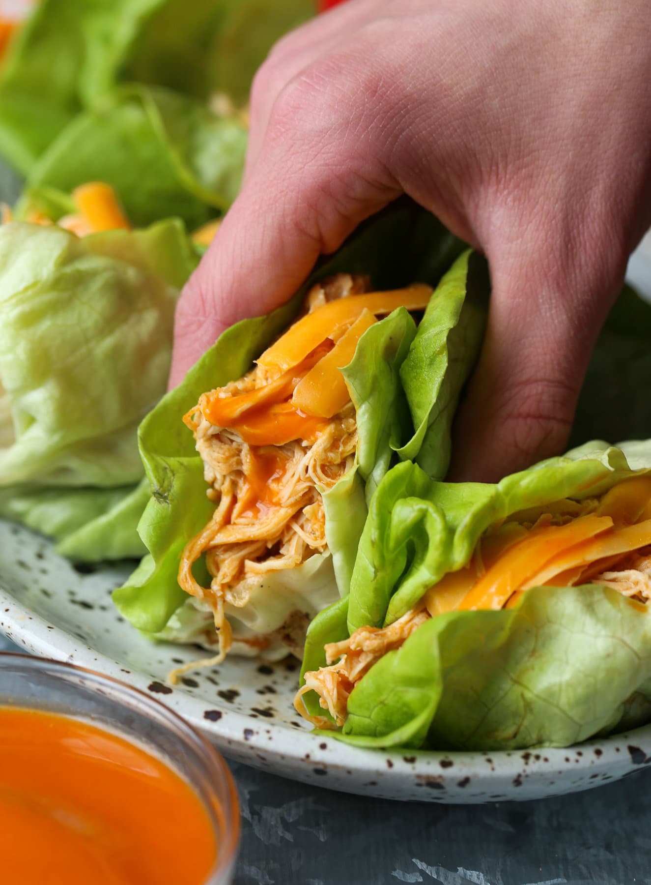 Lettuce wrapped buffalo chicken topped with cheese