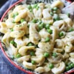 15 minute Cream Cheese Alfredo Sauce served with pasta and peas