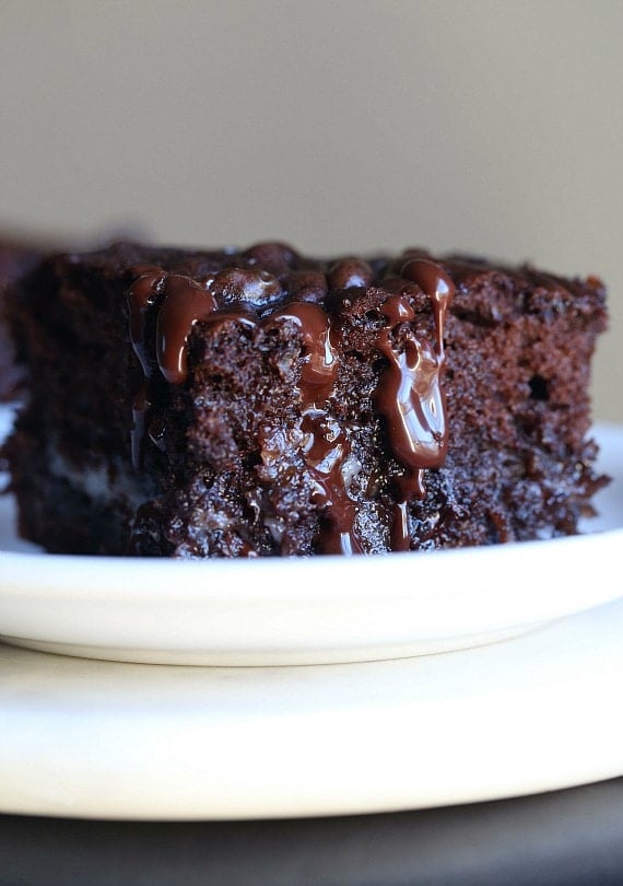 A slice of chocolate earthquake cake on a white plate.