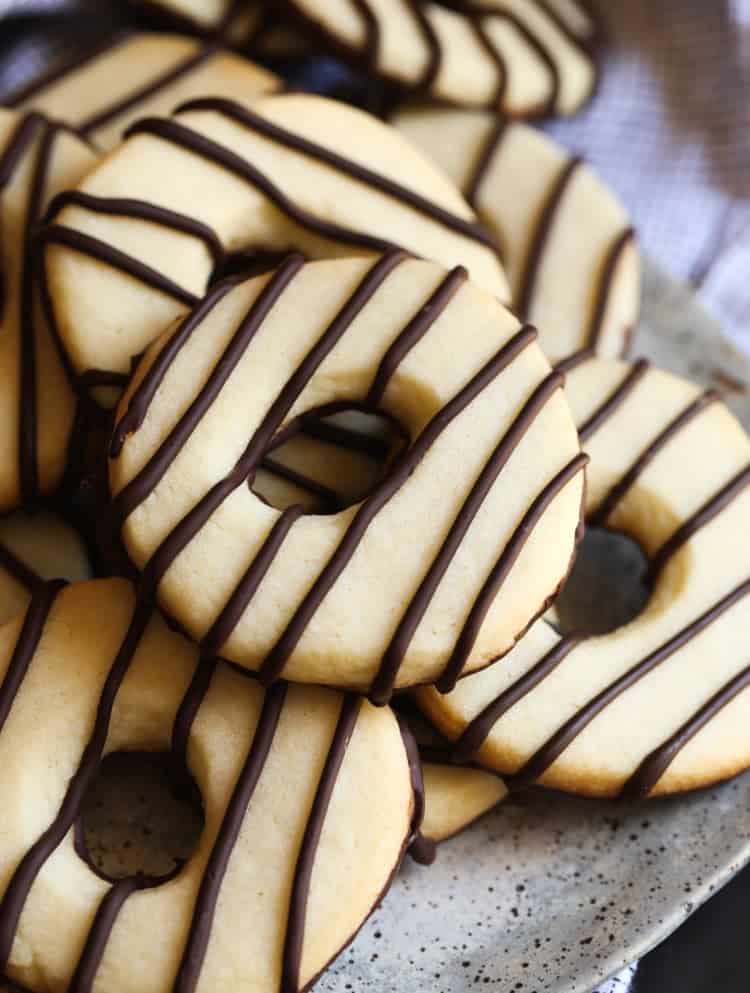 Assorted homemade fudge stripe cookies on a plate.