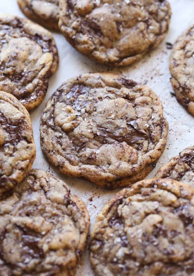 Baked chocolate chip cookies on parchment paper