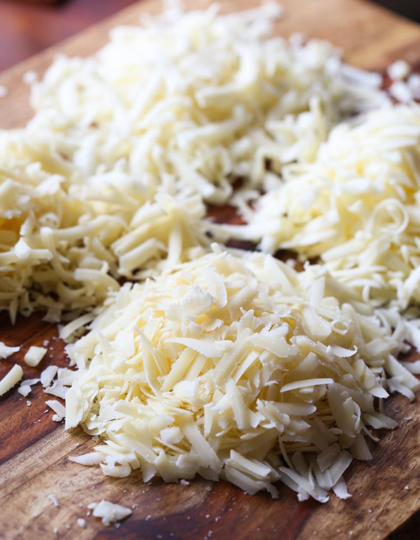 Grated Cheese On a chopping board