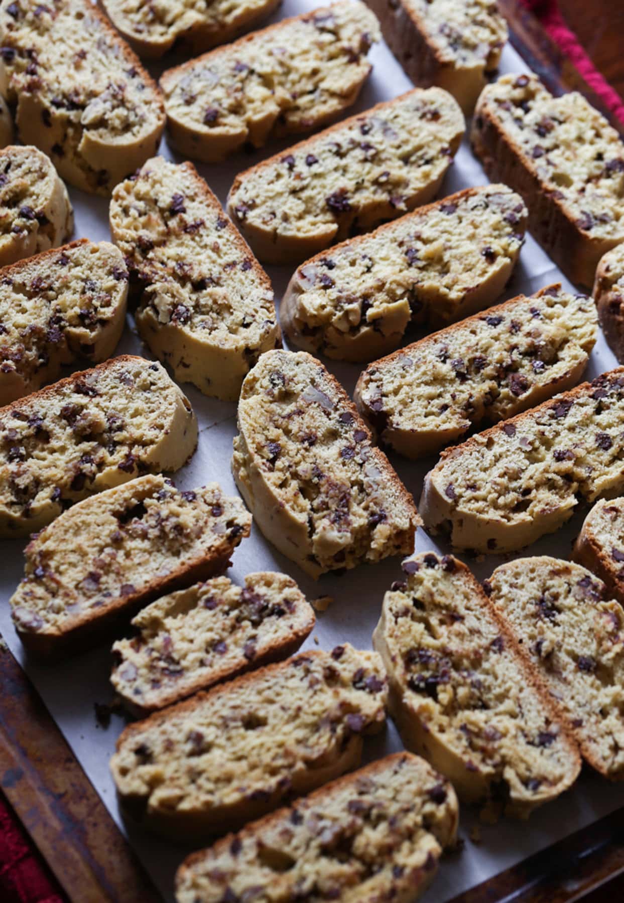 Baked biscotti on a baking sheet lined with parchment paper