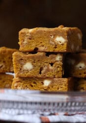 Three pumpkin blondies stacked on top of one another.