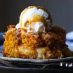 Pumpkin Dump Cake is deliciously sweet easy pumpkin cake recipe swirled with cream cheese and coconut.