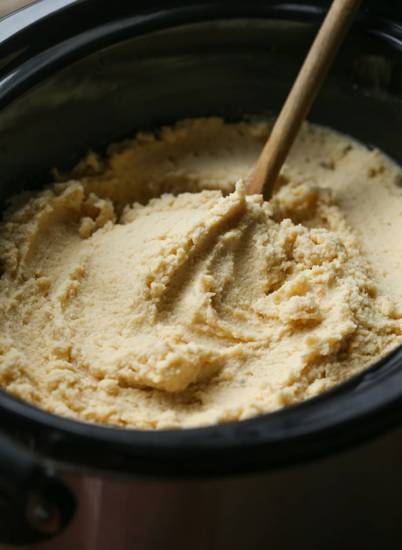 Stirring potatoes in a crockpot