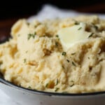 Crockpot Mashed potatoes topped with butter.