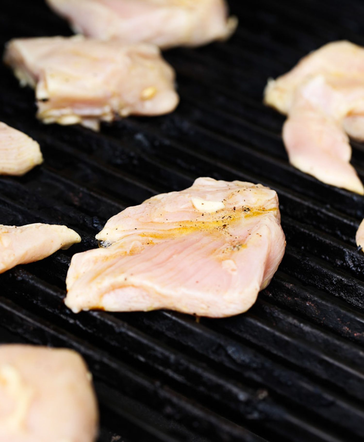 Chicken on the grill topped with citrus juice